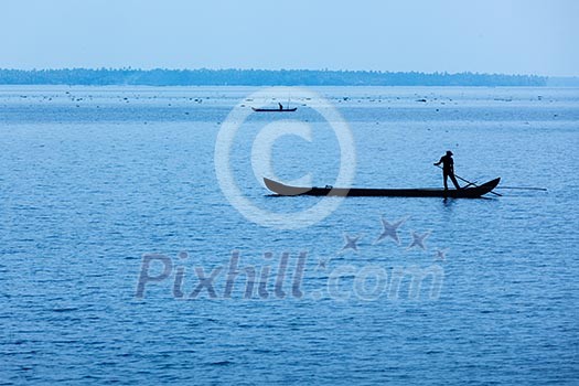 Man on boat. Kerala, India Man on boat. Kerala, India