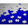 Jigsaw puzzle assemble on blue