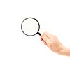 Woman hand holding magnifying glass isolated on white background