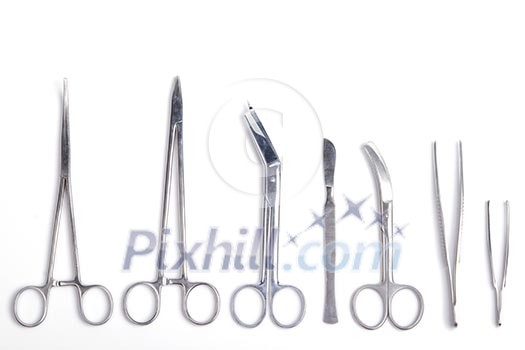 Surgeon tools - scalpel, forceps, clamps, scissors - isolated on white background