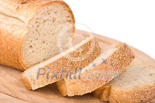 Sliced bread on wooden plate - shallow depth of field
