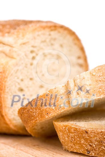Sliced bread on wooden plate - shallow depth of field Sliced bread on wooden plate - shallow depth of field