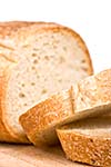 Sliced bread on wooden plate - shallow depth of field