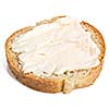 Slice of bread with cheese cream spread on it