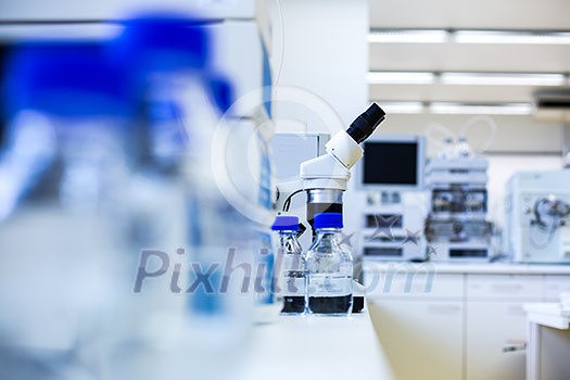 Chemistry lab (shallow DOF; focus on the beakers in the foreground)