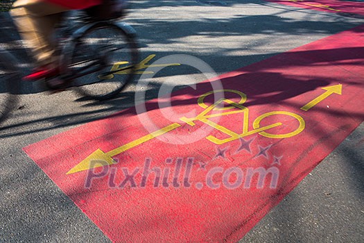 cyclist in bicycle lane on busy street cyclist in bicycle lane on busy street