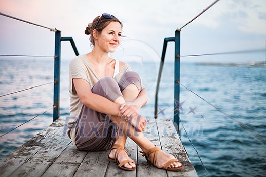 Portrait of a young woman at the seacoast while on vacation