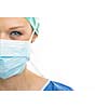 Close up of a pretty, blue-eyed, female surgeon. Half face composition. Looking confident and professional