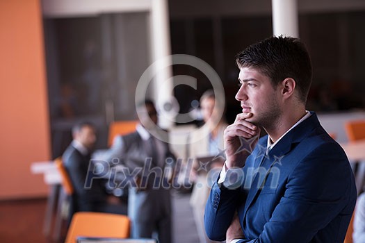 happy young business man portrait in bright modern office indoor