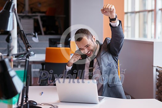 happy young business man portrait in bright modern office indoor