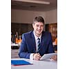 happy young business man portrait in bright modern office indoor