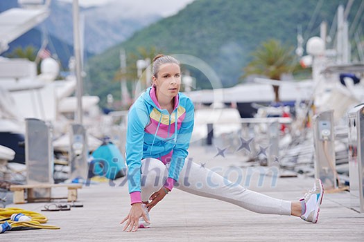woman jogging at early morning with yacht boats in marina woman jogging at early morning with yacht boats in marina