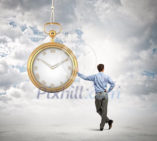 Image of young businessman and pocket watch. Time concept