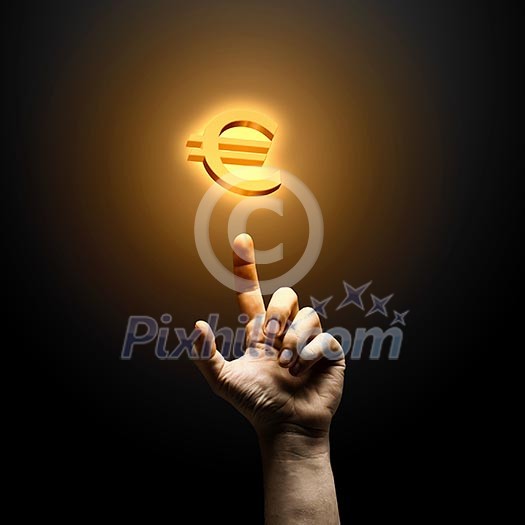 Human hand pointing at euro symbol. Banking concept