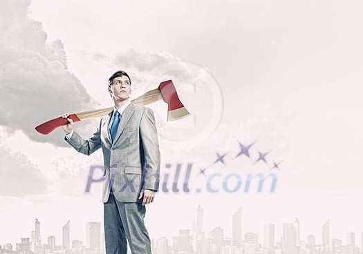 Young businessman holding big axe on shoulder Young businessman holding big axe on shoulder