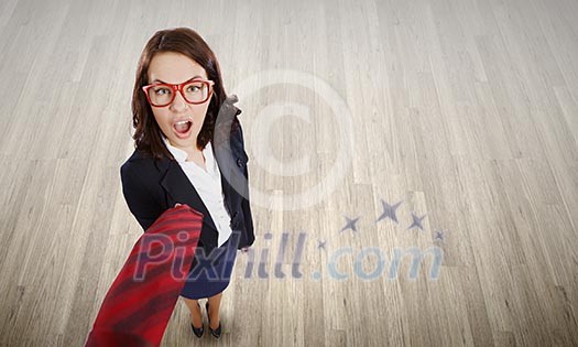 Top view of businesswoman pulling tie of boss