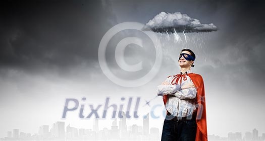 Young confident superman in mask and cape Young confident superman in mask and cape