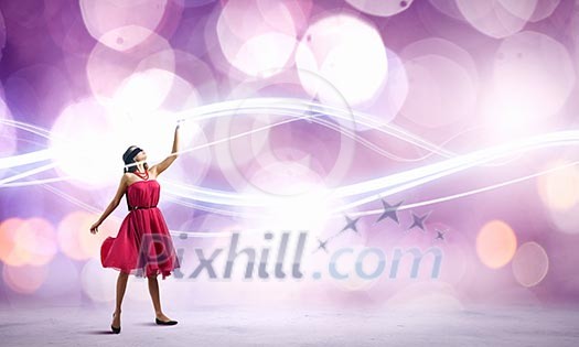 Woman in red dress and blindfold against bokeh background
