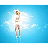 Pretty girl in swimming suit and hat against color background