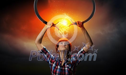 Image of woman holding electricity cable above head Image of woman holding electricity cable above head