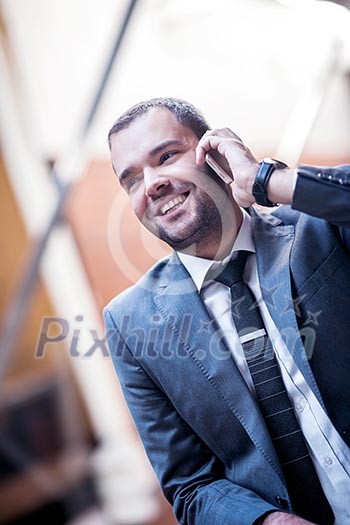 happy young business man portrait in bright modern office indoor