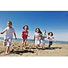 group of happy child on beach who have fun and play games