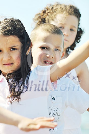group of happy child on beach who have fun and play games group of happy child on beach who have fun and play games