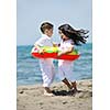 group of happy child on beach who have fun and play games