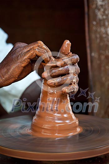 Potter throwing vase