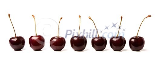 Seven cherries isolated on white