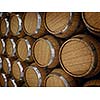 Wooden oak brandy wine beer barrels rows close up