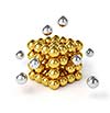 Business teamwork internet communication concept - metal spheres assembling into gold cubic structure isolated on white background