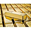 Banking finance concept background - gold bar on stacks of gold bullions close up