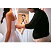 Pretty bride getting ready in front of a mirror
