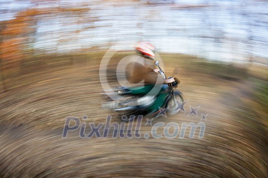 Bicycle riding in a city park on a lovely autumn/fall day (motion blur is used to convey movement) Bicycle riding in a city park on a lovely autumn/fall day (motion blur is used to convey movement)