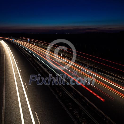 Cars moving fast on a highway