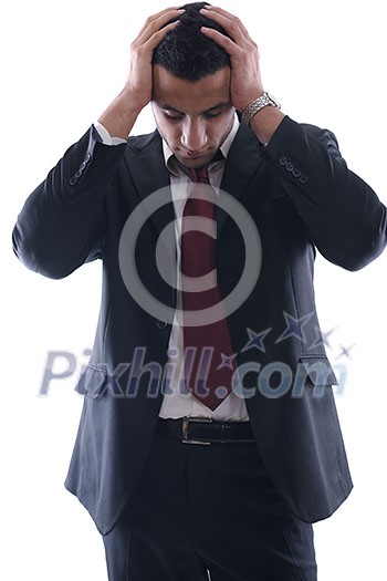 Portrait of a young business man looking depressed from work isolated over white background in studio