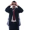 Portrait of a young business man looking depressed from work isolated over white background in studio