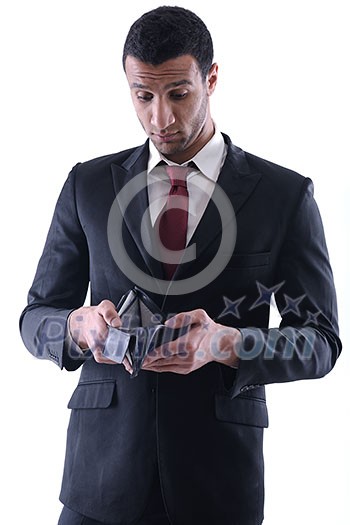 Portrait of a business man holding and catch falling money bills, isolated on white background in studio