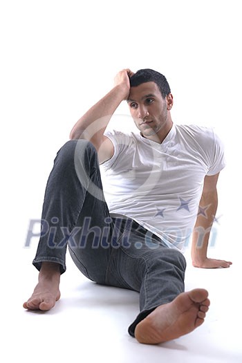 portrait of relaxed young man dressed in white shirt and jeans isolated over white background in studio portrait of relaxed young man dressed in white shirt and jeans isolated over white background in studio