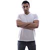 portrait of relaxed young man dressed in white shirt and jeans isolated over white background in studio