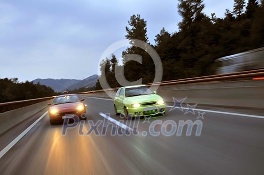 Fast tuning cars racing on the highway Fast tuning cars racing on the highway