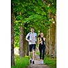 Young couple jogging in park at morning. Health and fitness.