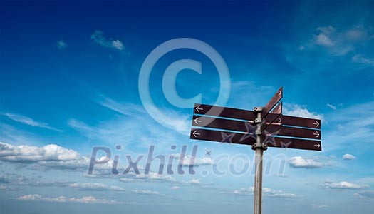 Blank signpost in sky with clouds