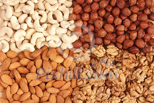 Different  nuts (almons, cashews, walnuts and filbers) close up