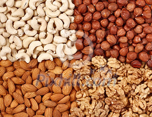 Different nuts (almons, cashews, walnuts and filbers) close up Different nuts (almons, cashews, walnuts and filbers) close up