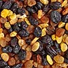 Mixed raisins of different colors close up