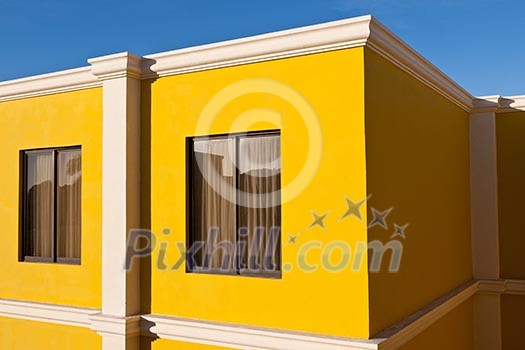 Yellow house and blue sky in the morning Yellow house and blue sky in the morning