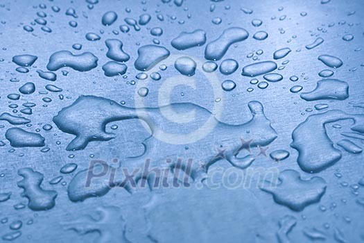 Water droplets on metal background macro blue tinted Water droplets on metal background macro blue tinted