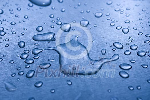 Water droplets on metal background macro blue tinted Water droplets on metal background macro blue tinted
